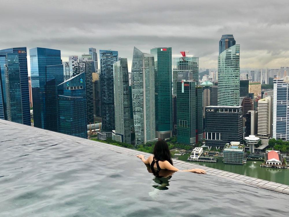Nicola in the Infinity pool facing the Singapore city views