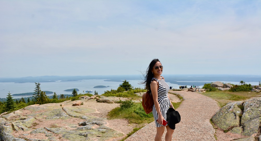 Frances standing on the peak of Cadillac mountain