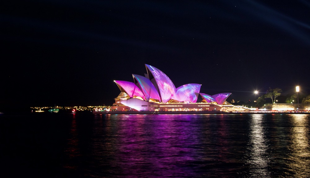 Opera House lit with pink and purple colours